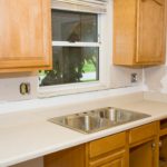 This rental unit kitchen is in the process of being remodeled. New cabinets, laminate counter tops and sink are partially installed.