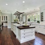 Can you say "cabinets"! White beautiful cabinets everywhere define this gorgeous galley kitchen.