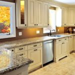 A striking light tan modern luxury kitchen interior with solid surface countertops