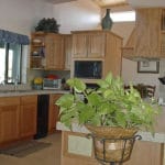 Sierra Remodeling kitchen remodel oak cabinets tiled counters black appliances