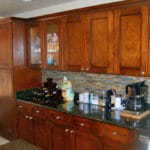 Sierra Remodeling kitchen remodel cherry shaker cabinets with multi color backsplash and granite countertops